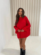 Red loose turtleneck sweater with wide sleeves and relaxed hemline