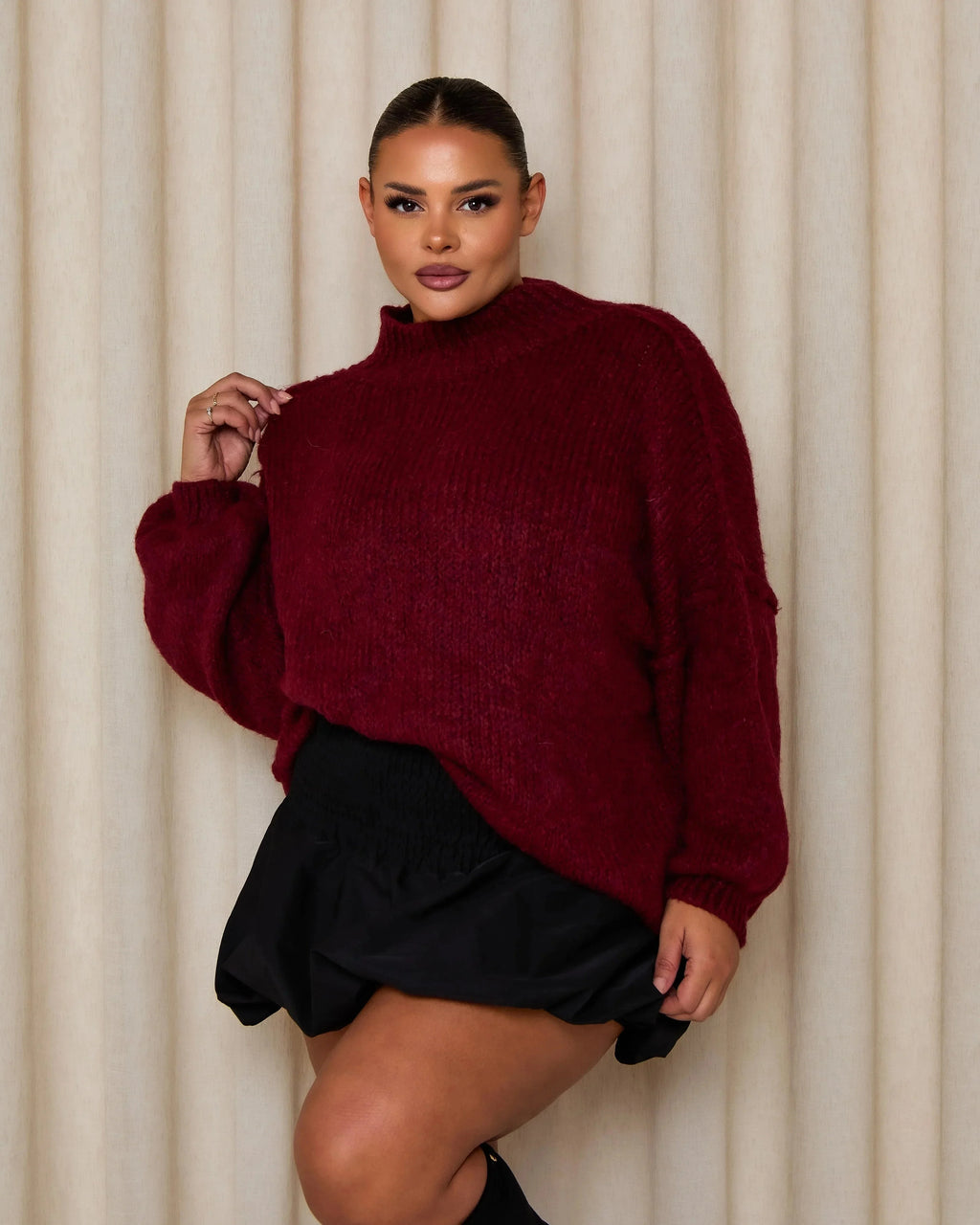Burgundy turtleneck sweater with textured knit and relaxed, drop-shoulder shape
