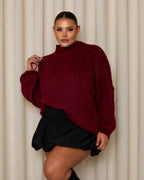Burgundy turtleneck sweater with textured knit and relaxed, drop-shoulder shape