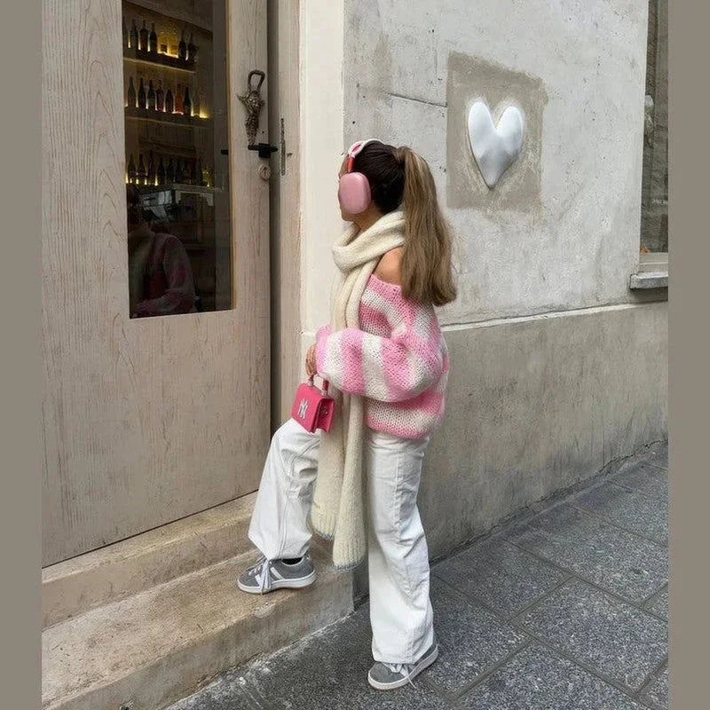 Pink and cream striped knit sweater with off-shoulder neckline and long sleeves
