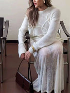 Women's white textured knit sweater with cable-like swirl pattern, crew neck