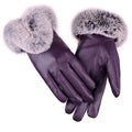 Purple leather gloves with thick gray faux fur cuffs and stitched fingers.