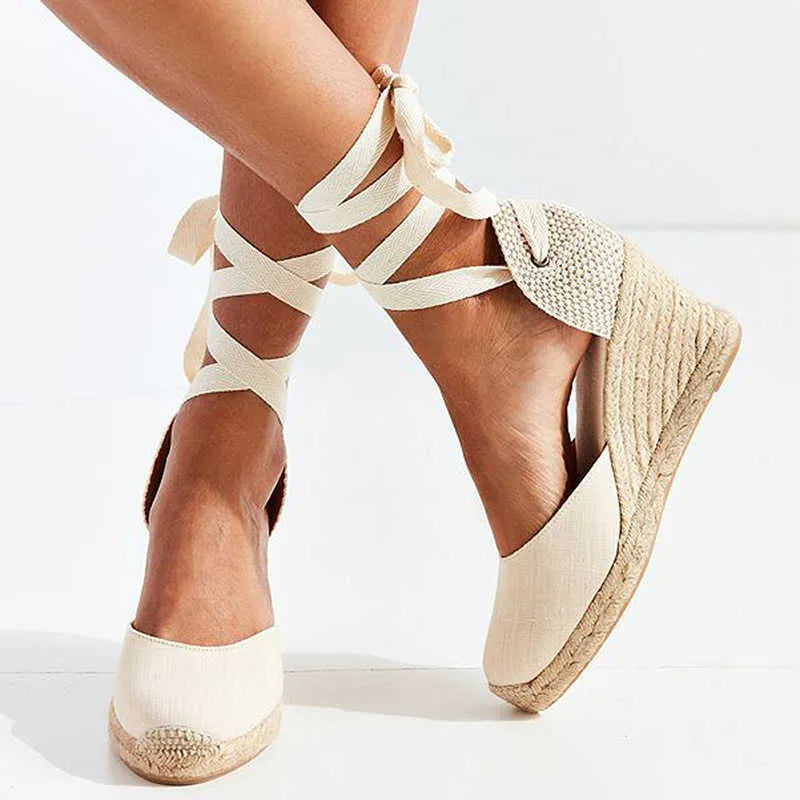 Espadrille wedge sandals with ankle-tie straps, light canvas upper and woven jute wedge
