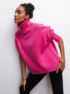 Hot pink knitted turtleneck sweater with long sleeves and ribbed cuffs and hem