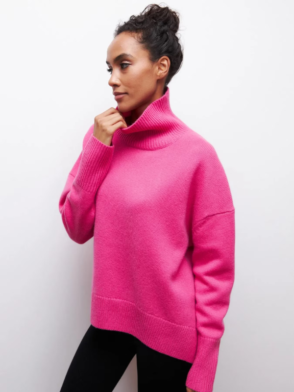 Hot pink knitted turtleneck sweater with long sleeves and ribbed hem