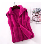 Bright pink fleece bodywarmer vest with full zip front and stand collar, sleeveless