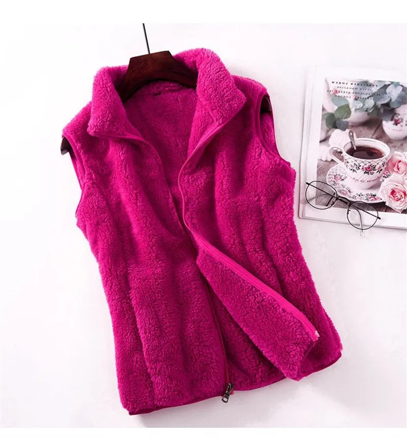 Bright pink fleece bodywarmer vest with full zip front and stand collar, sleeveless