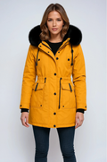 Women’s parka coat with faux fur hood in mustard yellow, drawcord and front flap pockets