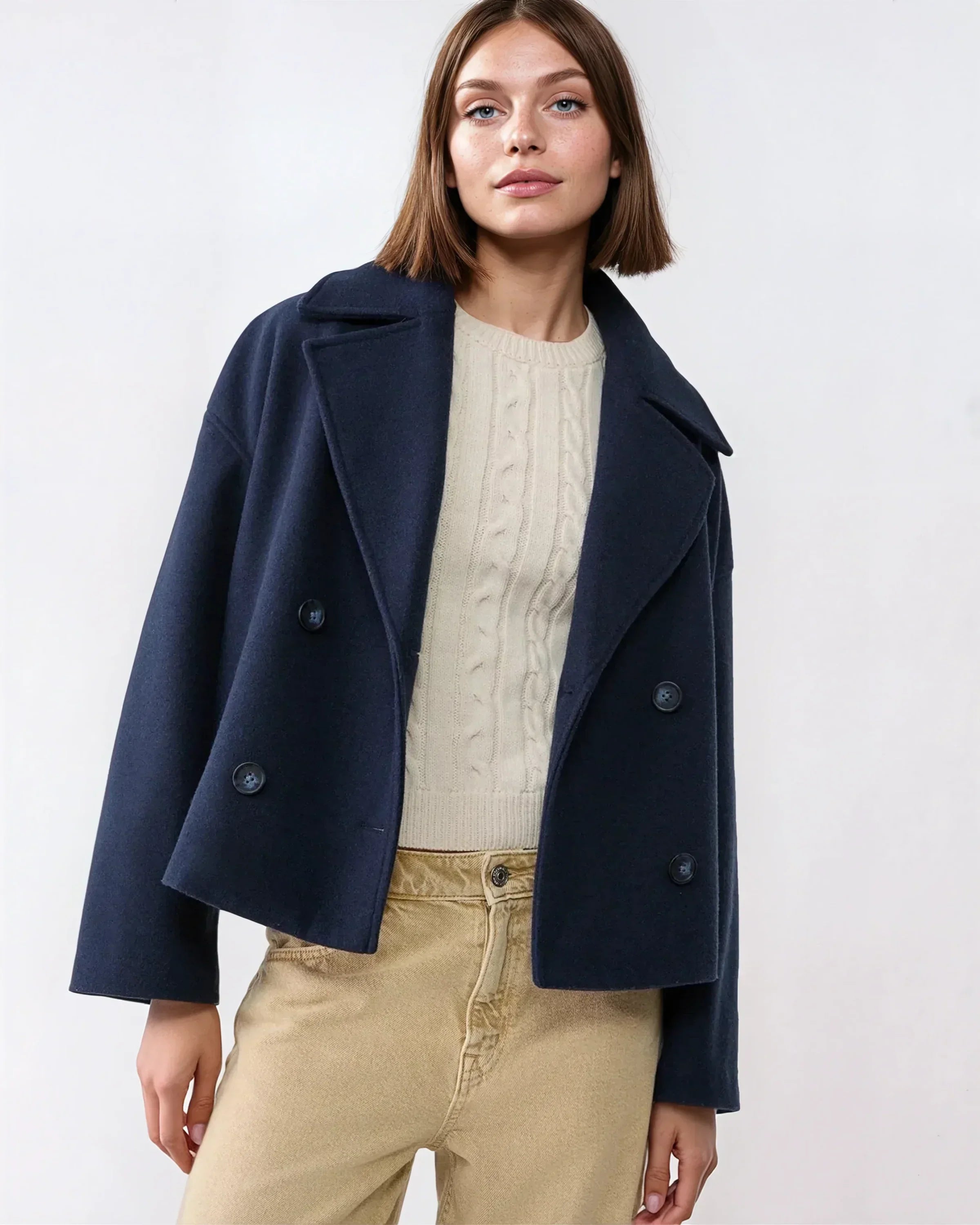 Navy short double-breasted wool jacket with flap pockets and dark buttons