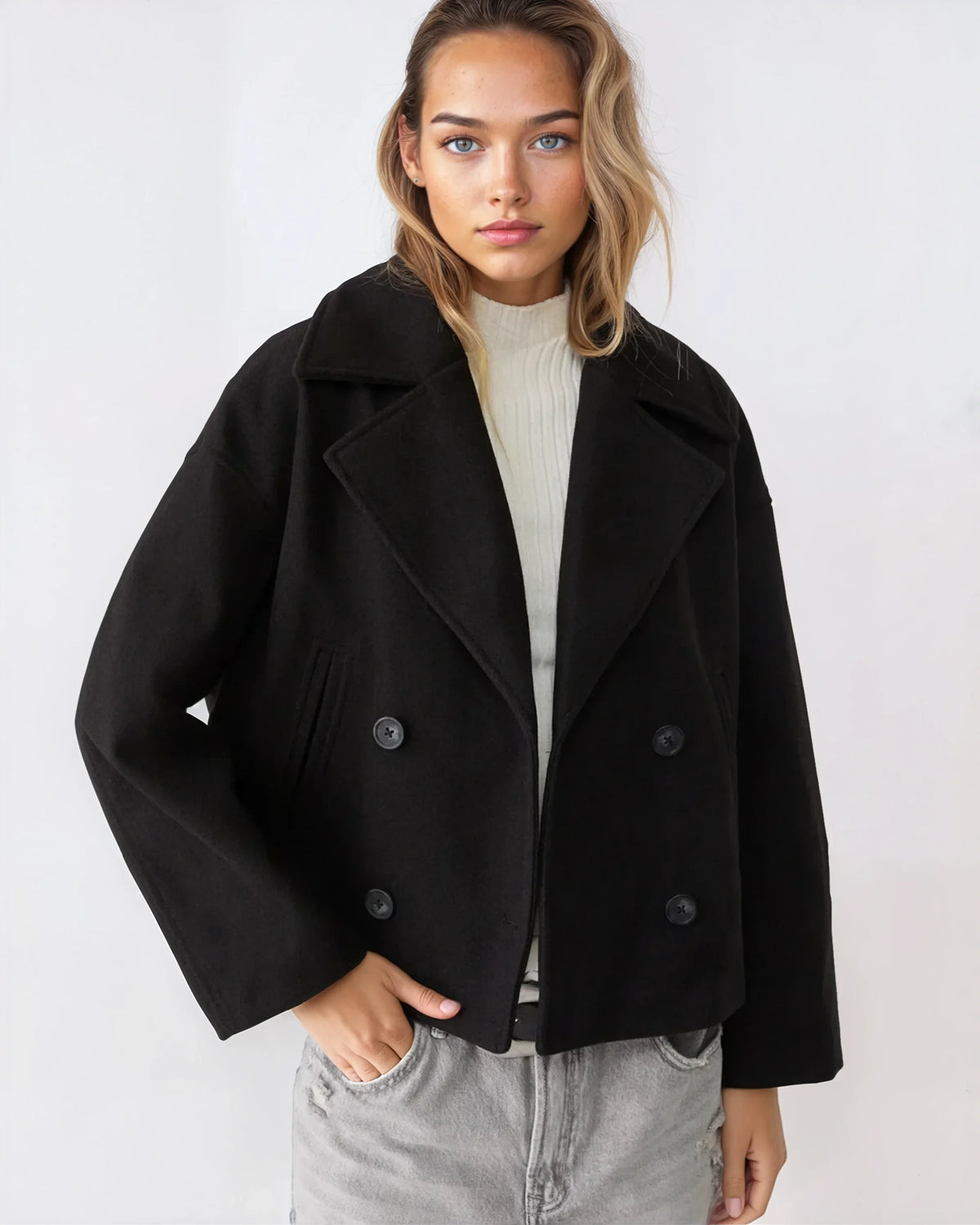 Black short double-breasted wool jacket with notch collar and buttoned cuffs