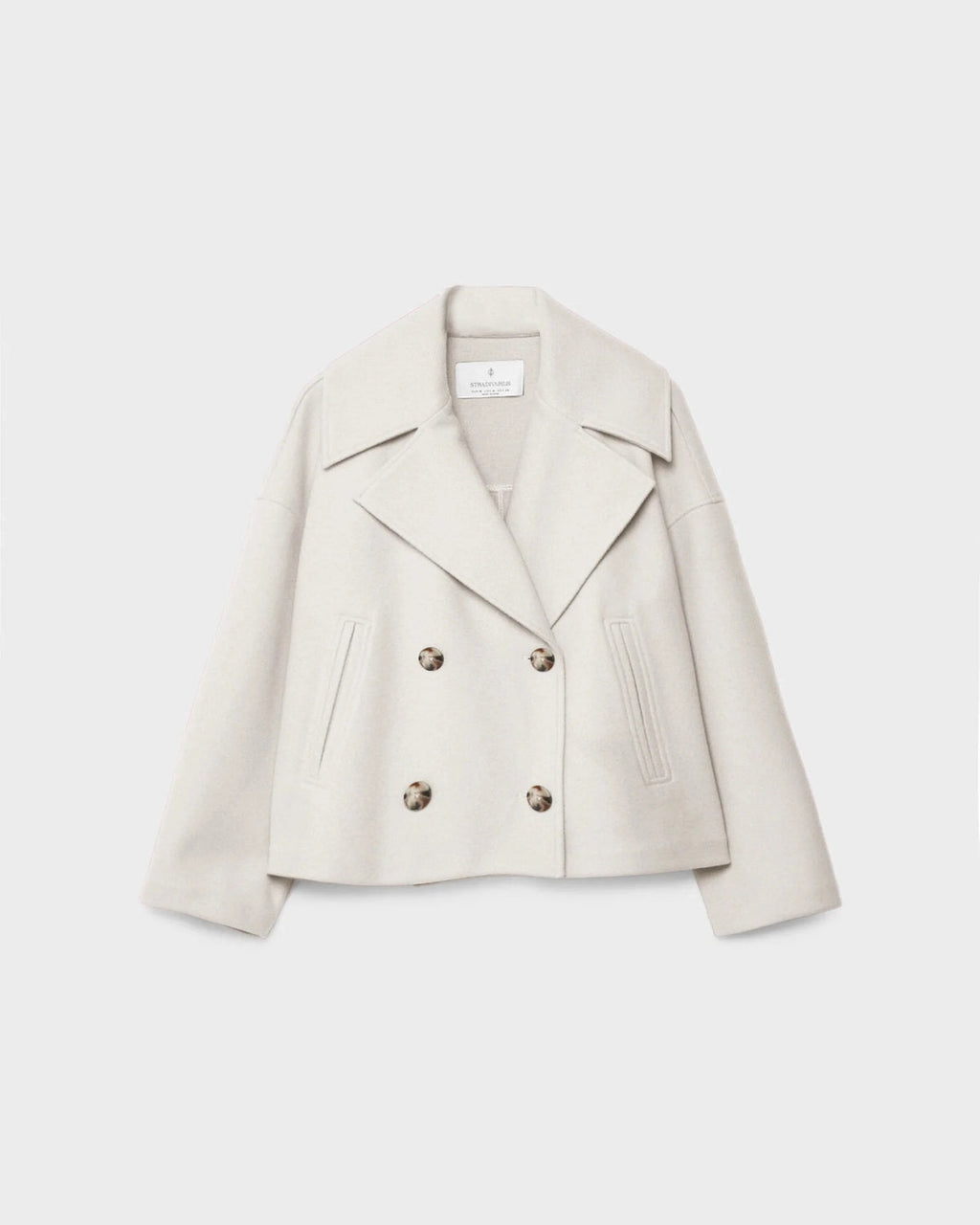 Women’s short double-breasted wool jacket, light cream, notch lapels, flap pockets