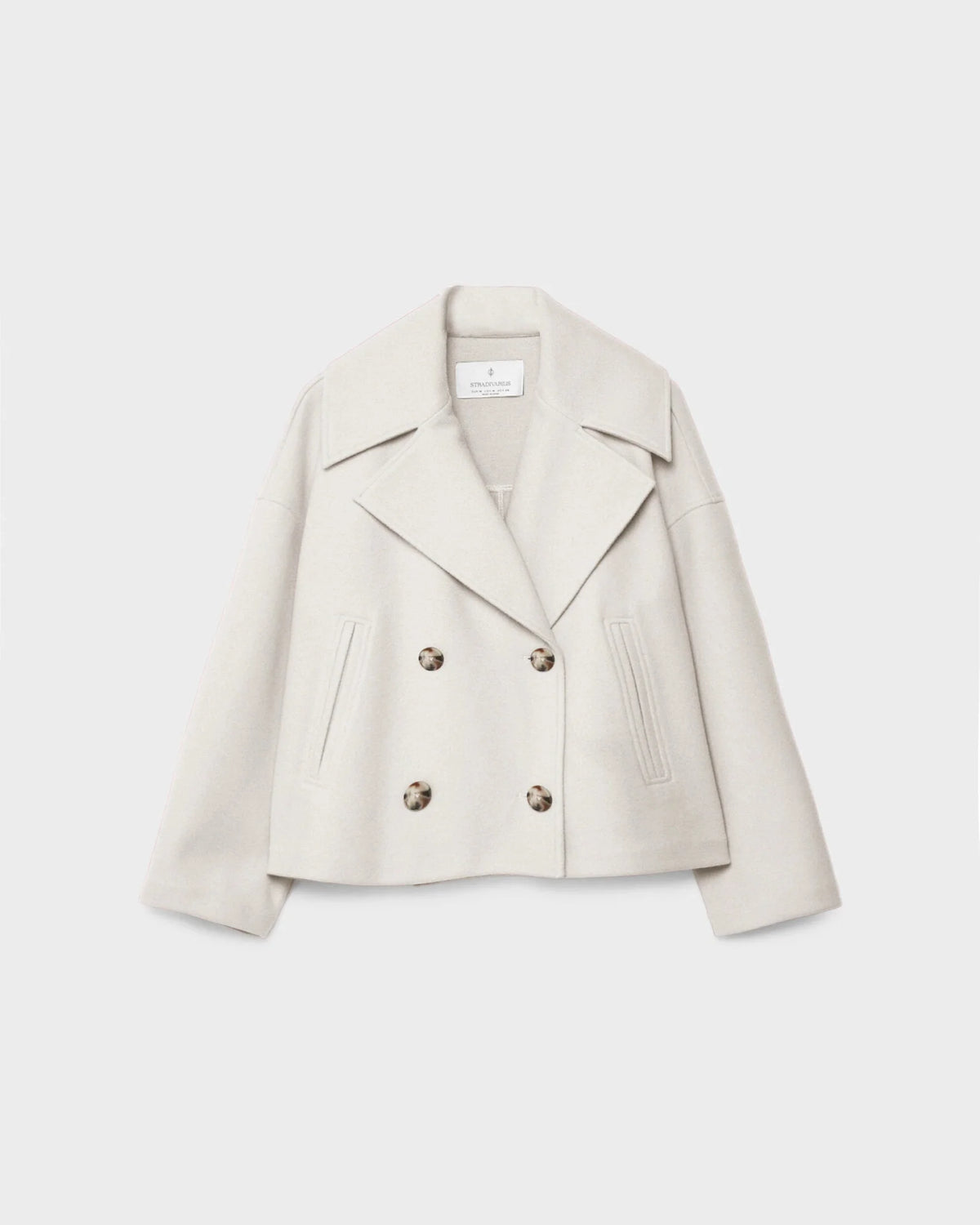 Women’s short double-breasted wool jacket, light cream, notch lapels, flap pockets