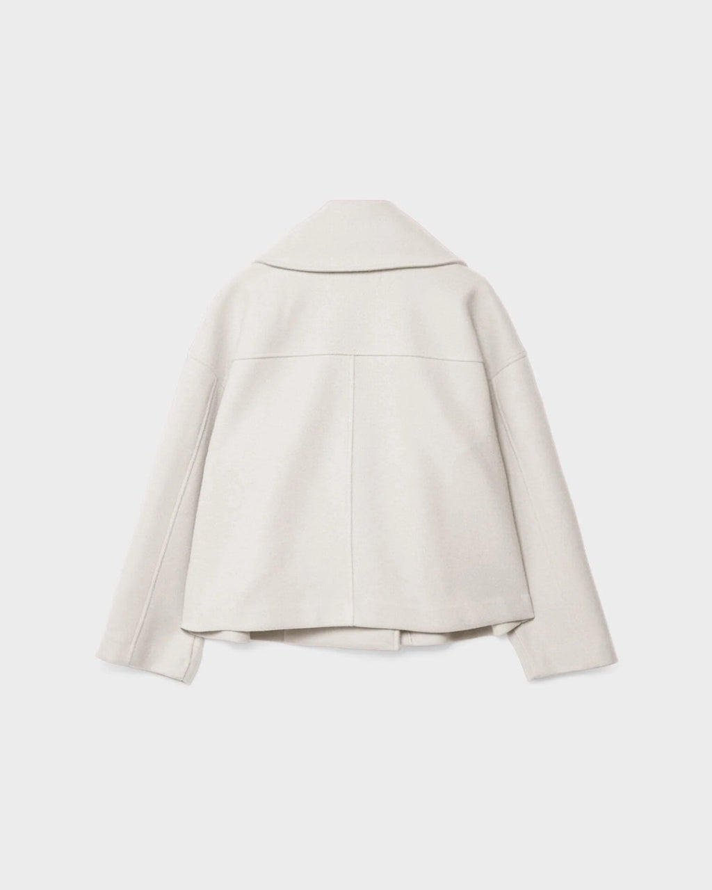 White short double-breasted wool jacket, back view with yoke and center seam