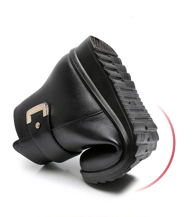 Black ankle boots with side buckle strap and textured rubber sole