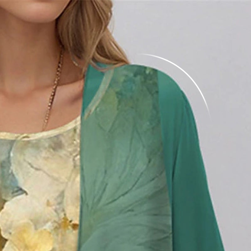 Green open-front dress overlay fabric close-up with sheer drape