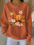 Orange ribbed women's sweatshirt with fall pumpkin graphic and leaf accents