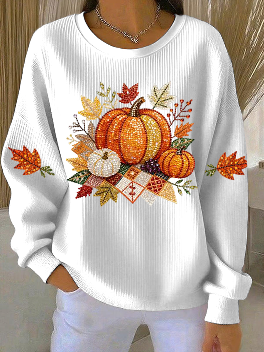White ribbed women's sweatshirt with fall pumpkin graphic and leaf accents