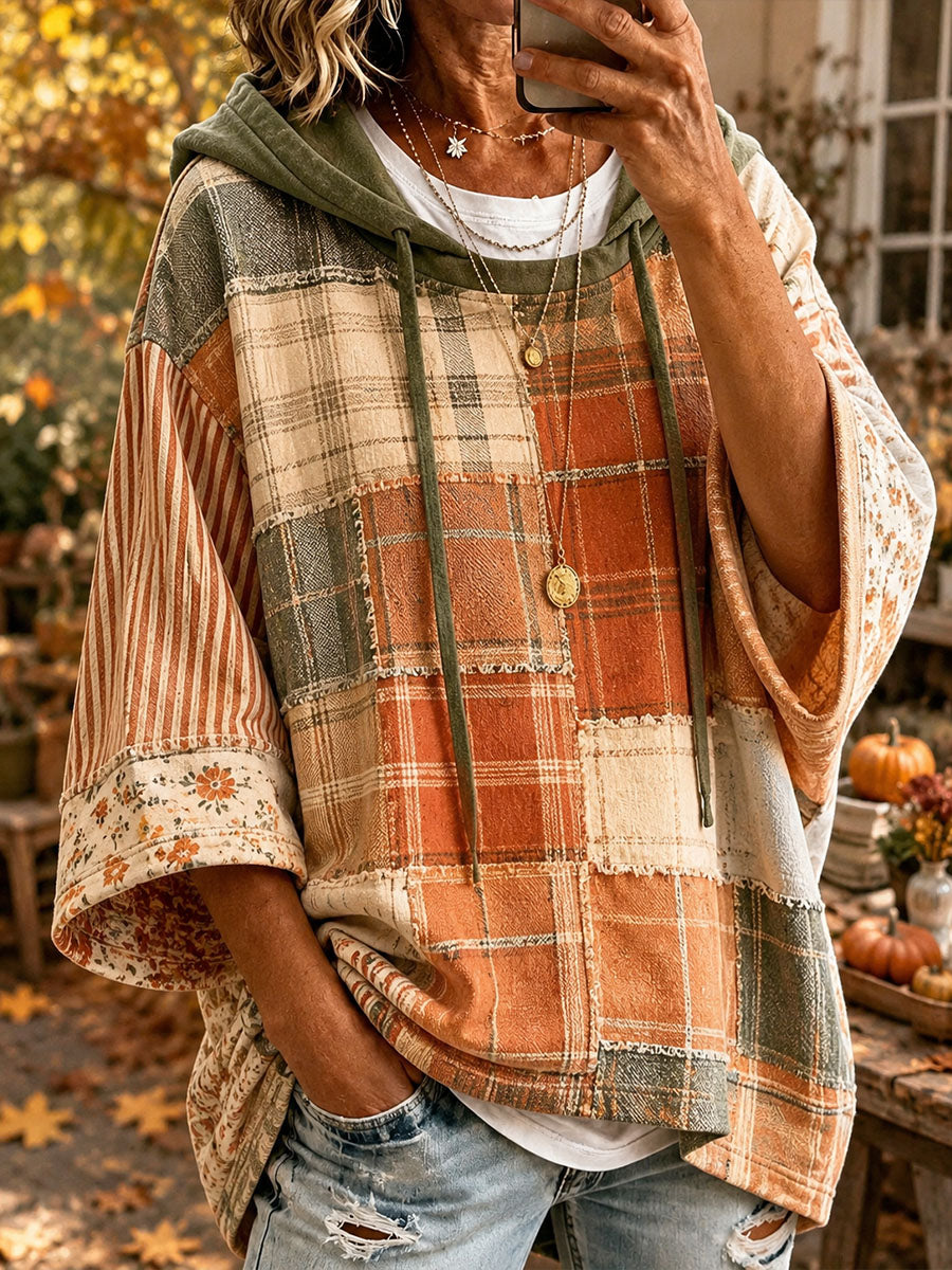 Women's patchwork print hoodie with green plaid and orange panels, front pocket, hood