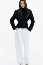 Black trench coat with stand-up collar, button placket, and tied waist belt