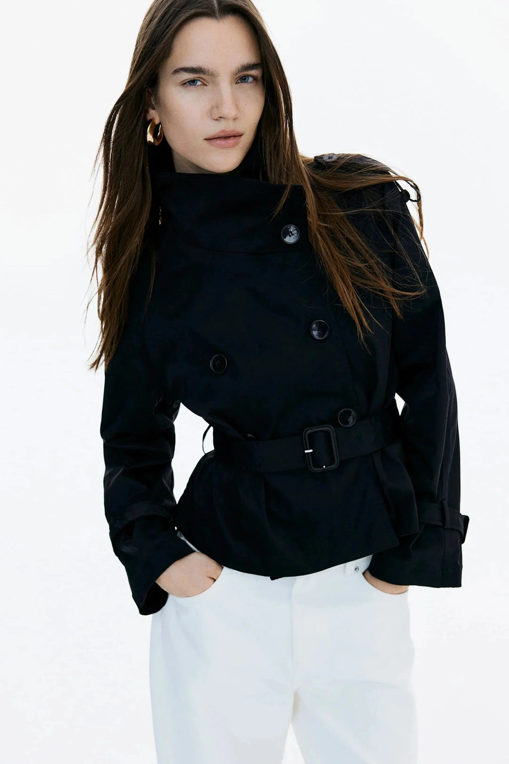 Black trench coat with stand-up collar and tied waist belt, long sleeves