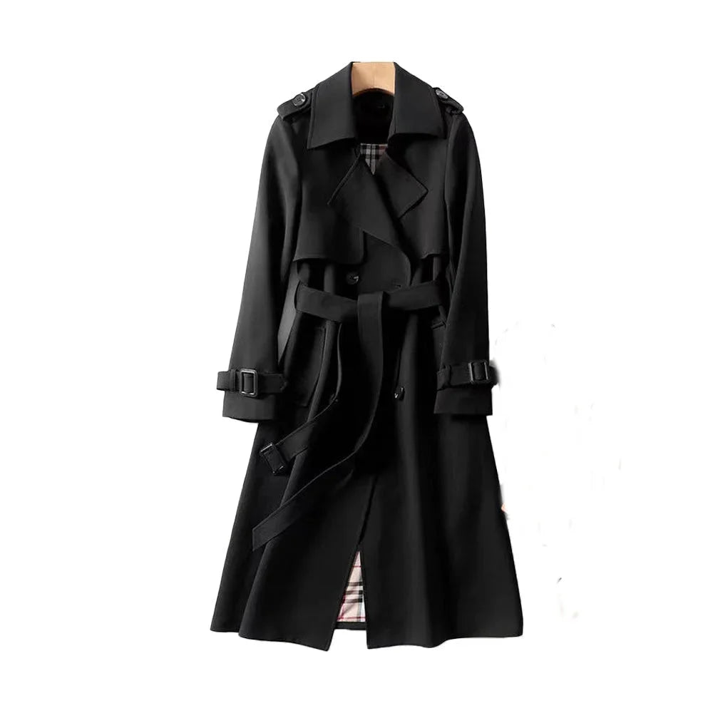Women’s long trench coat with belt and lapels in black, plaid lining visible.