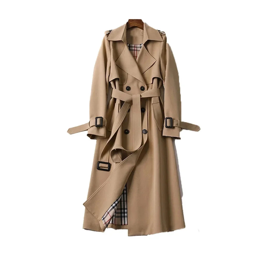 Women’s long trench coat with belt and lapels in light brown, plaid lining visible.