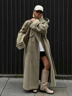 Olive long oversized trench coat with wide lapels, double-breasted buttons