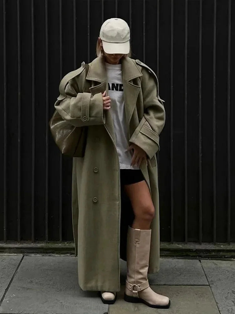 Olive long trench coat with wide lapels and button front, oversized fit