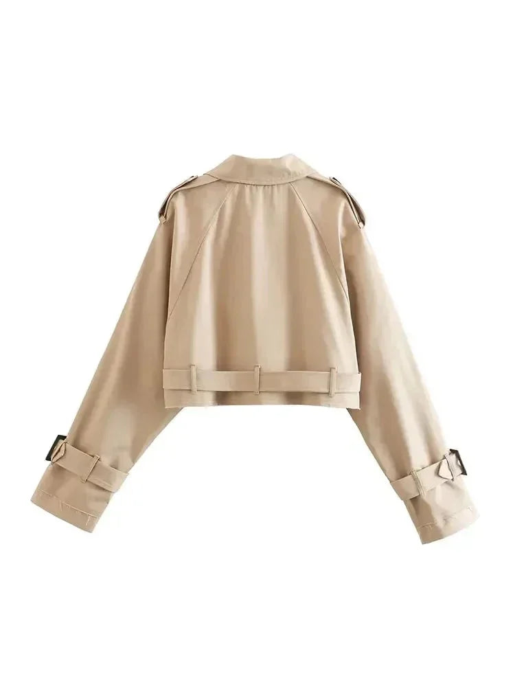 Short light-brown trench coat back view with yoke, belted waist, cuff straps