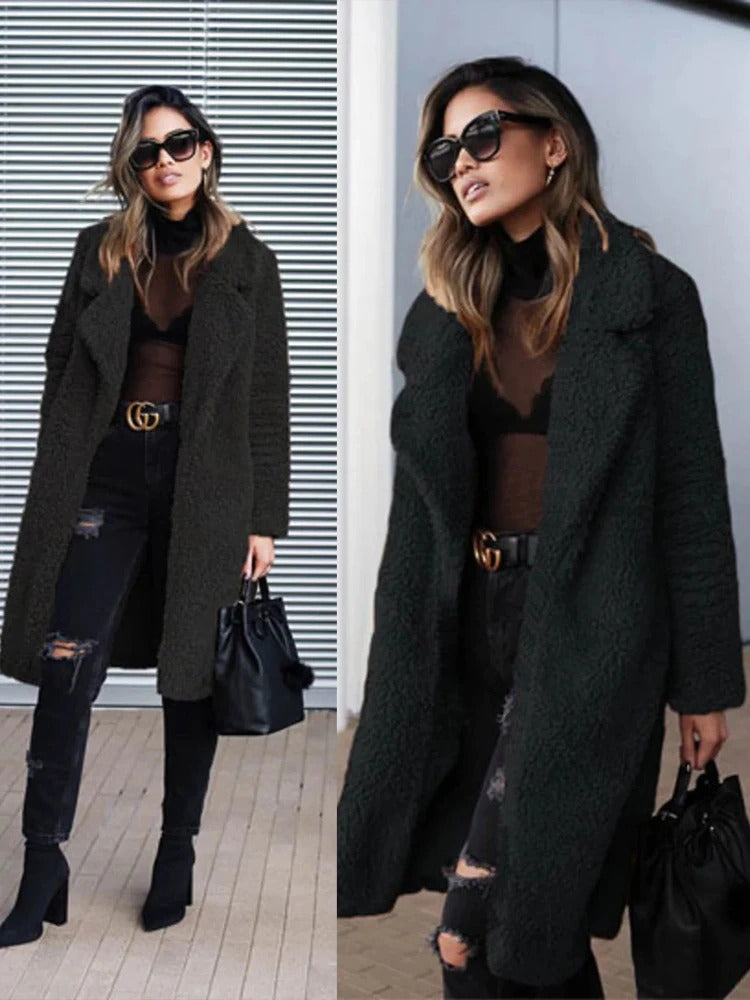 Long teddy coat in black fuzzy texture, open front with wide collar.