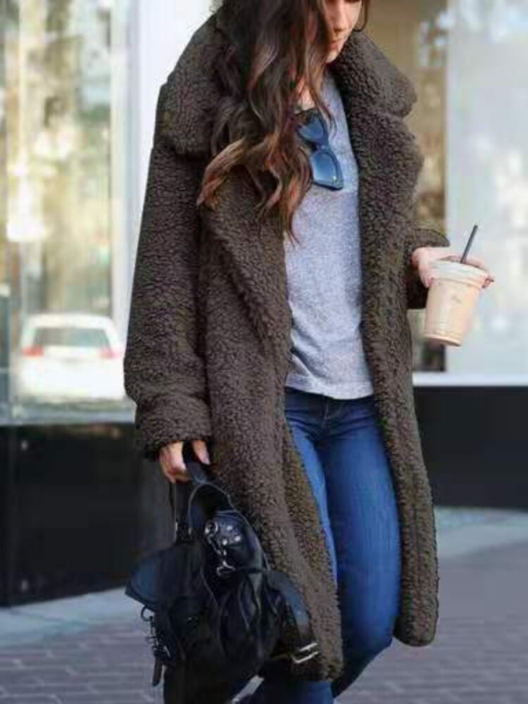 Long teddy coat in dark brown fuzzy fabric, open front with plush collar.