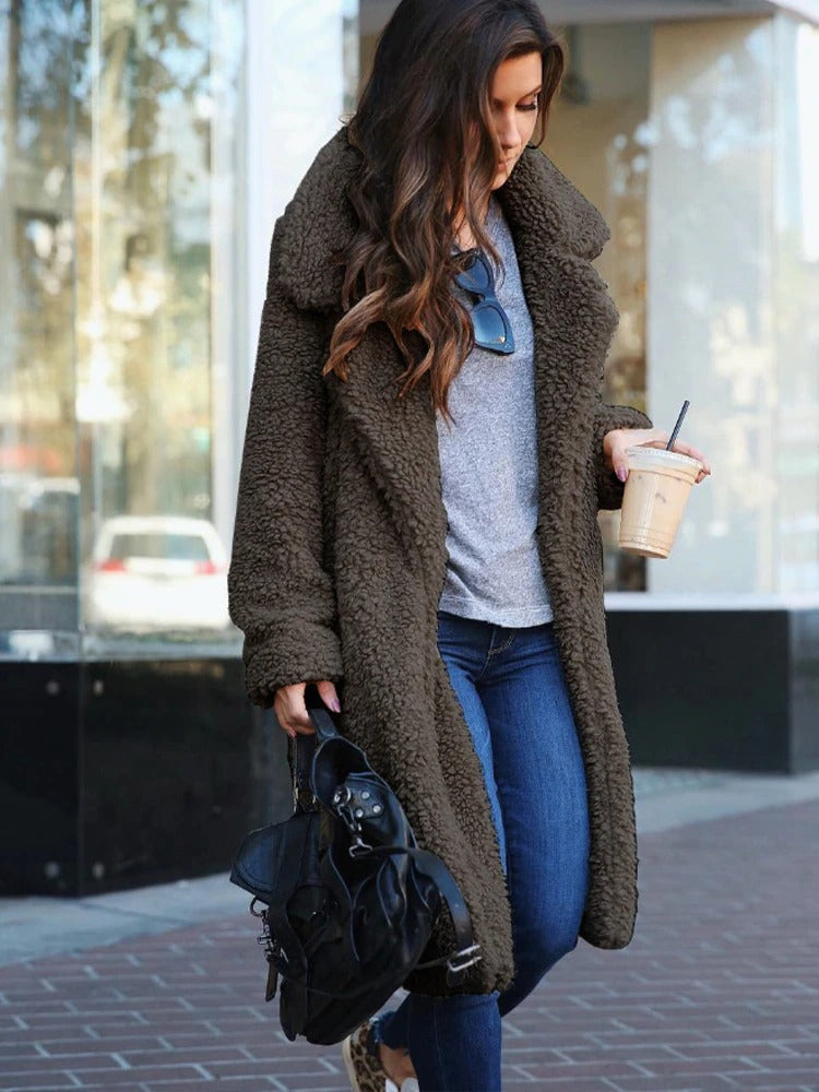 Long teddy coat in dark brown fuzzy fabric, open front with plush collar.