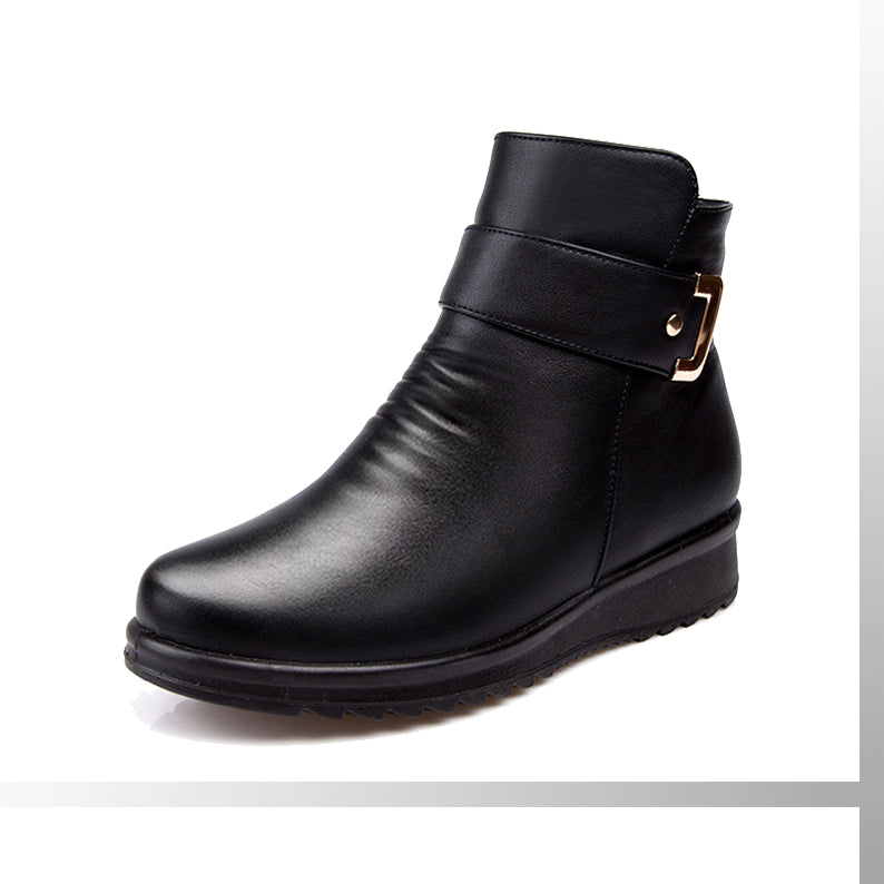 Women’s black ankle boots with side buckle strap and smooth leather-look upper