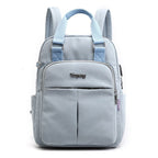Light blue backpack with adjustable straps and front zip pocket panel
