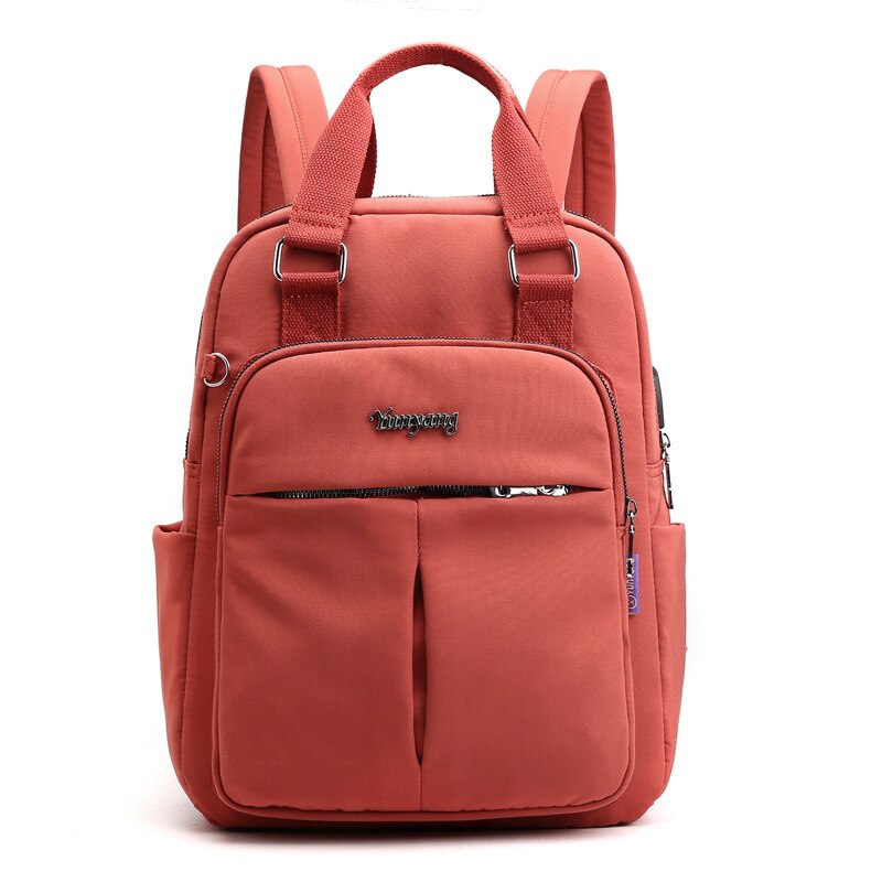 Coral water-resistant backpack with padded top handles, front zip pocket, two front compartments