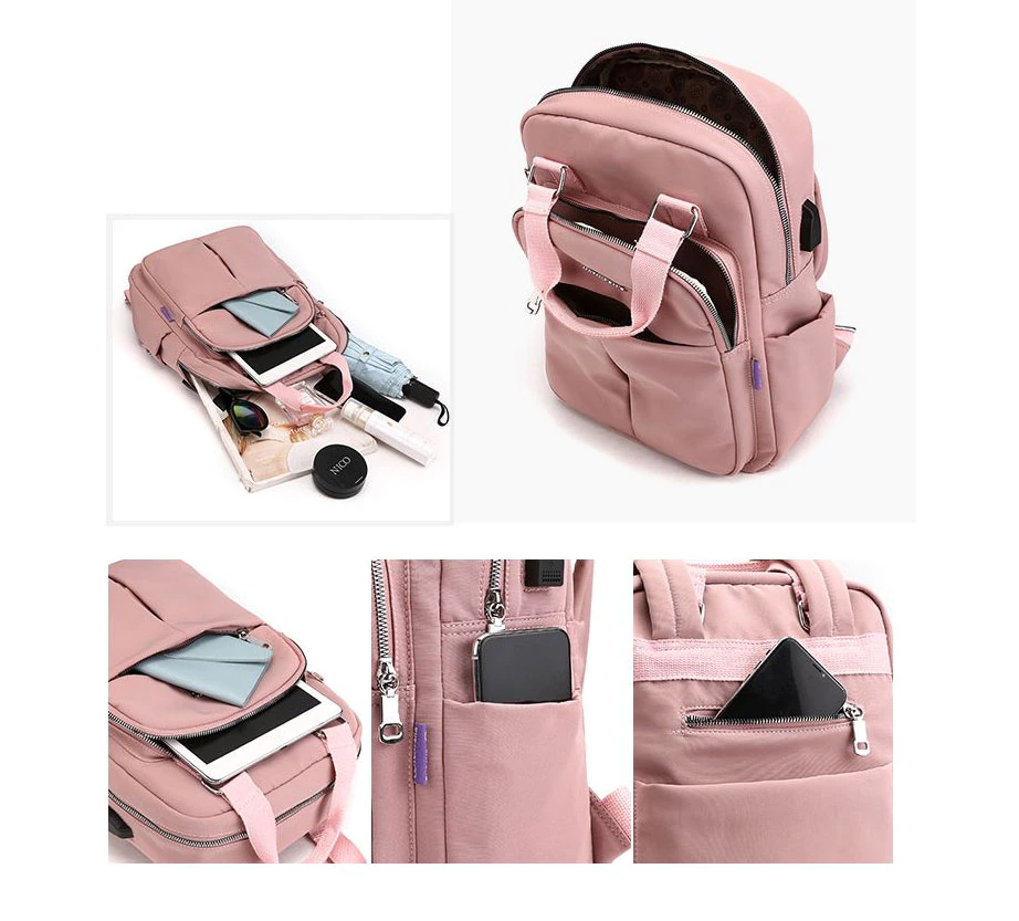 Pink anti-theft backpack with front pocket, zipper details, and open accessory compartment