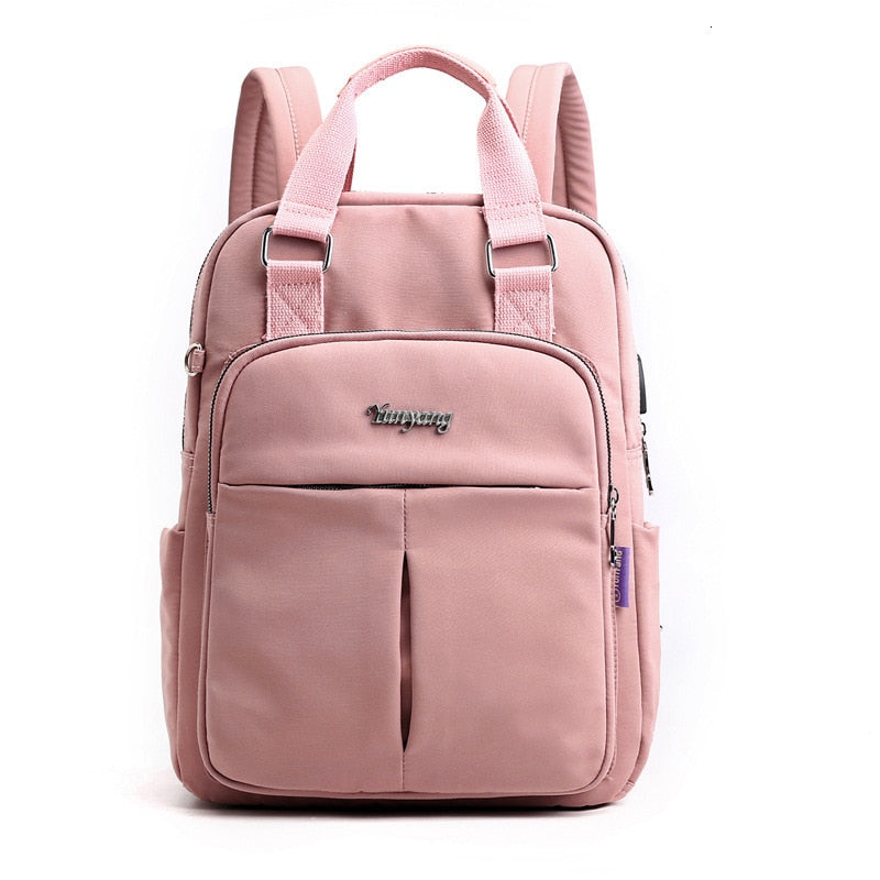 Pink backpack with central front pocket divider and adjustable shoulder straps