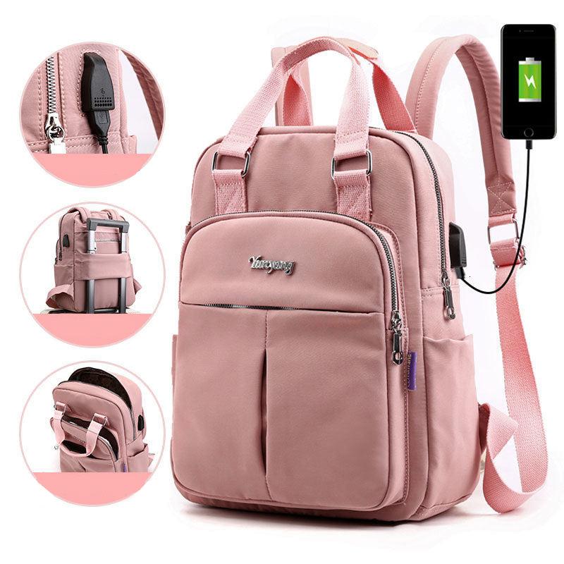 Light pink water-resistant backpack with USB charging port, padded handles, front zip pocket