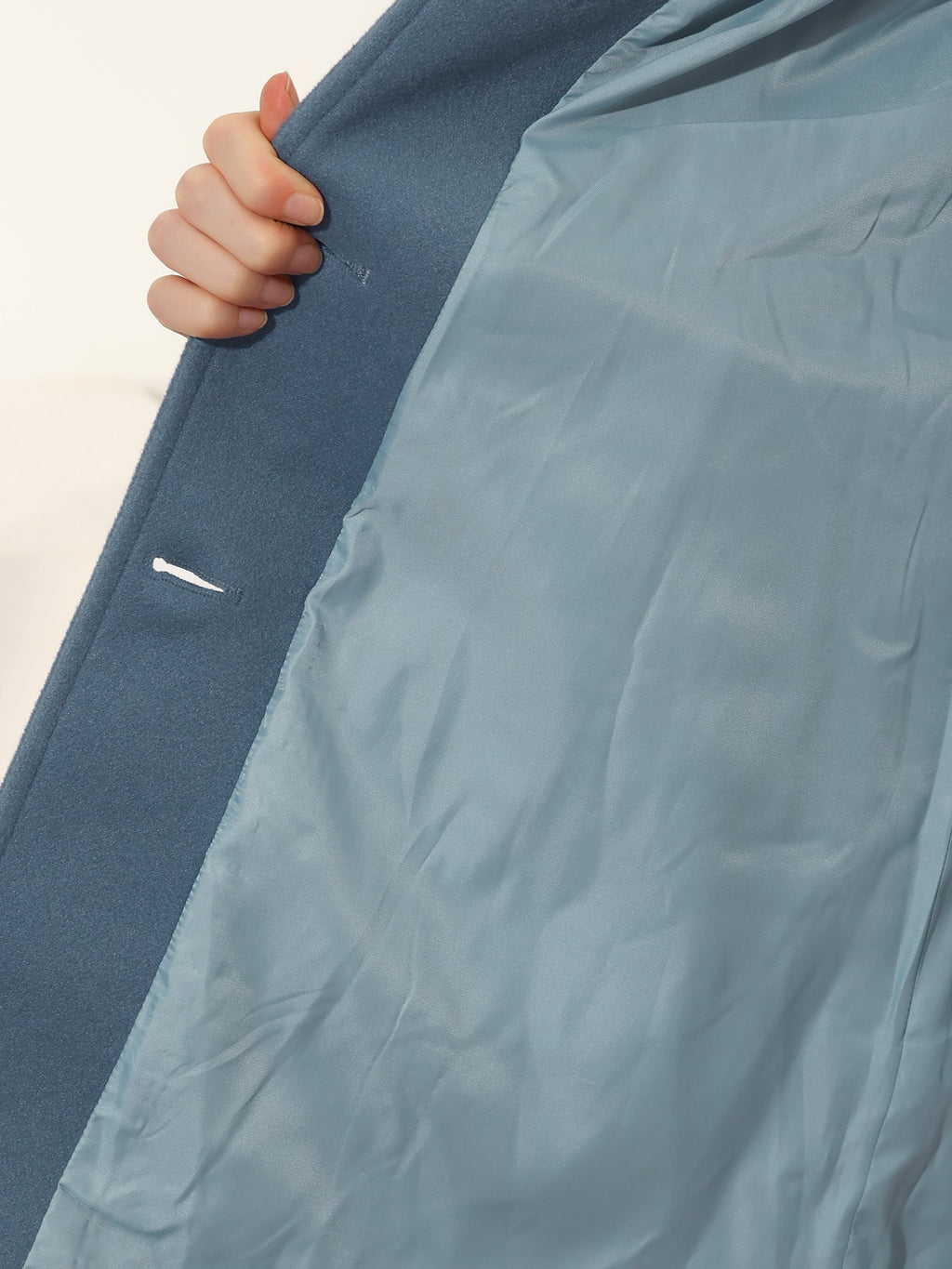 Light blue single-breasted winter trench coat with inner lining and button placket detail