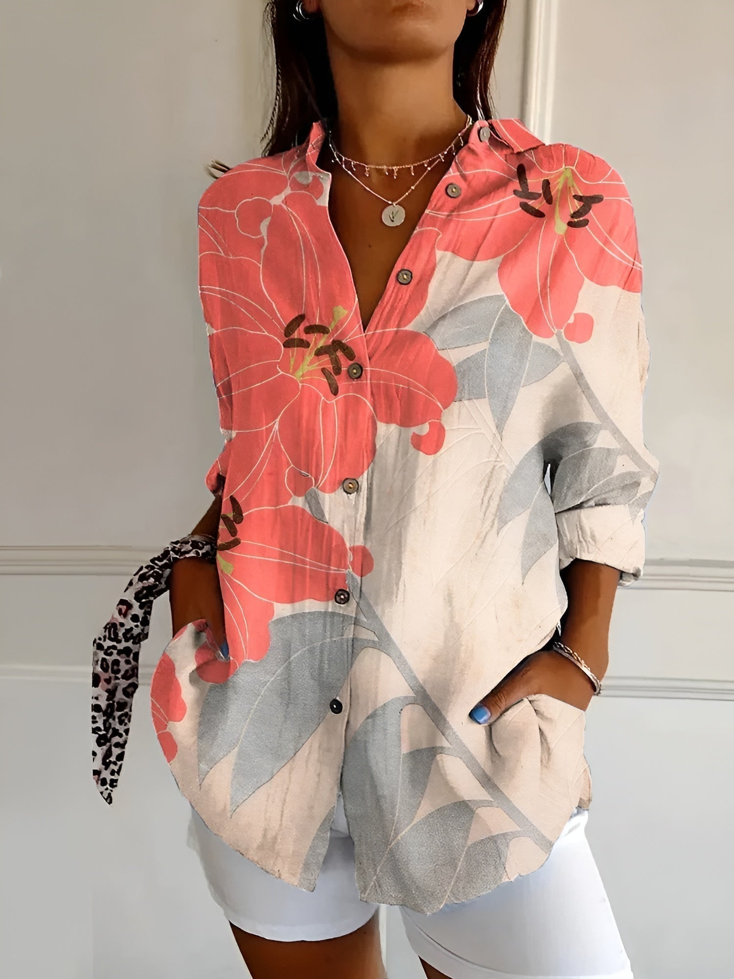 Abstract print split-neck button blouse with long sleeves, coral pink and gray floral print