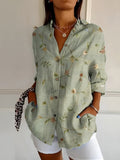 Women's abstract print split-neck blouse, light sage green with tiny floral sprigs