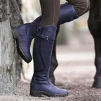 Purple knee-high waterproof boots with buckle strap and rugged grippy sole