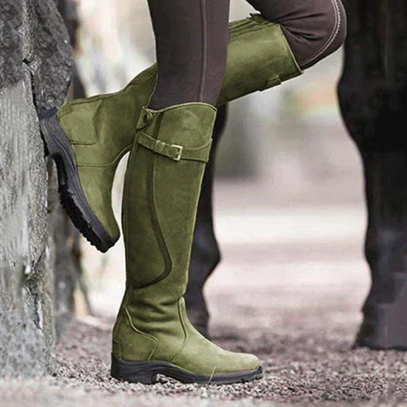Olive green knee-high waterproof boots with buckle strap and rugged grippy sole