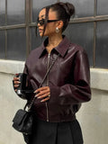 Women’s burgundy faux leather bomber jacket with zip front and ribbed cuffs, cropped hem