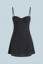 Black polka dot mini dress with structured bust and thin spaghetti straps