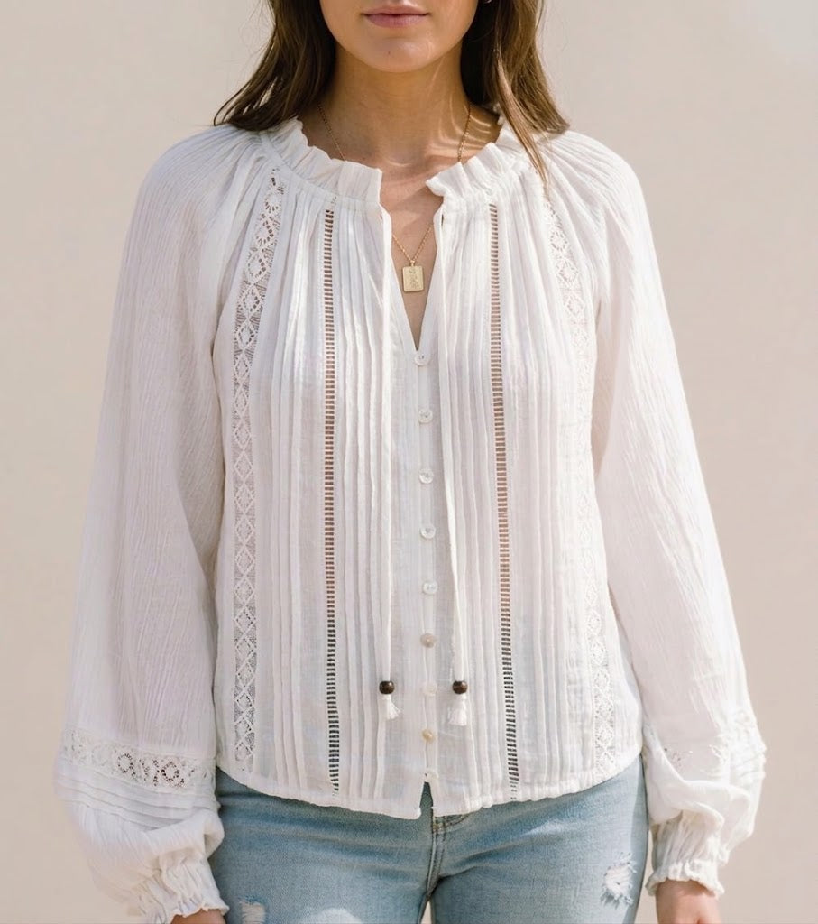 White lace-trim blouse with V-neck and long puff sleeves, vertical pintuck stripes, buttons