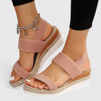 Blush pink two-strap platform sandals with open toe and jute-edged sole