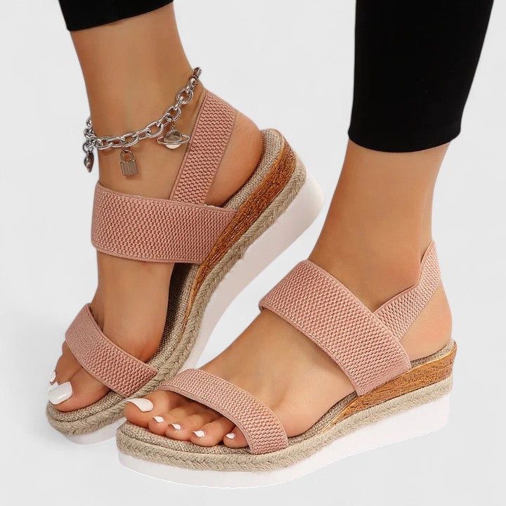Blush pink two-strap platform sandals with open toe and jute-edged sole