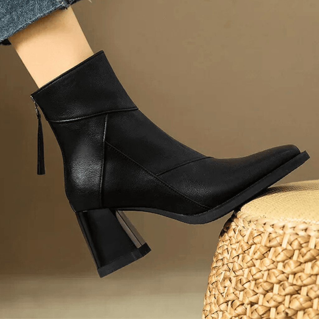 Black ankle-fit block heel boots with side tassel and stitched V-panel detail