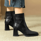 Black ankle-fit block heel boots with side zipper and textured upper